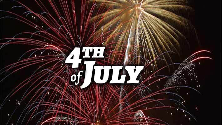 4th of July in front of fireworks.