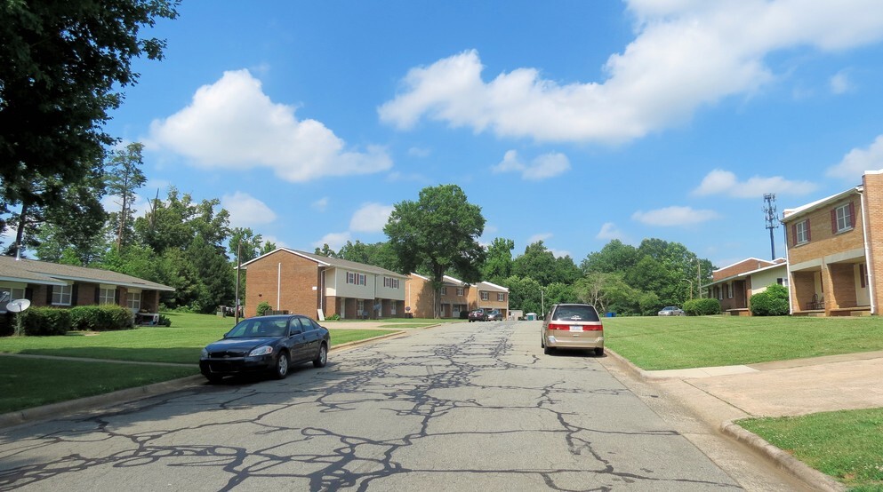 A street with brick buildings on both sides.