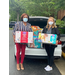 BHA Executive Director receives donation of diapers, wipes and hygiene products from Alamance Service League representative. 