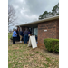 BHA and ABSS staff prepare for meal distribution at Pate Homes.